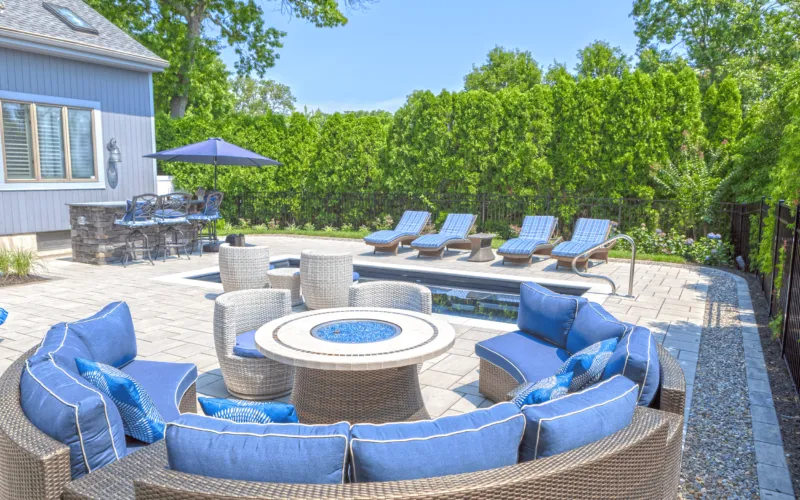 Outdoor seating with an inground pool - Puravida Custom Pools