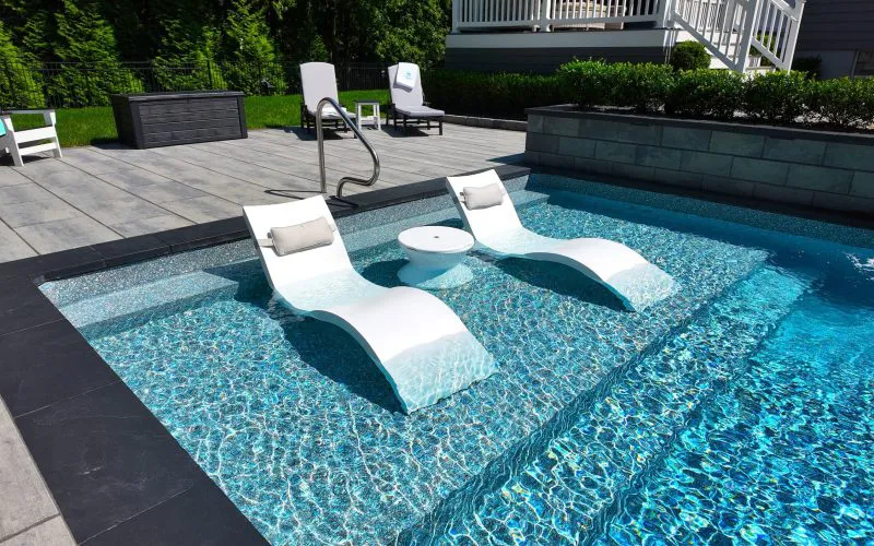 Seats within an inground pool - Puravida Custom Pools