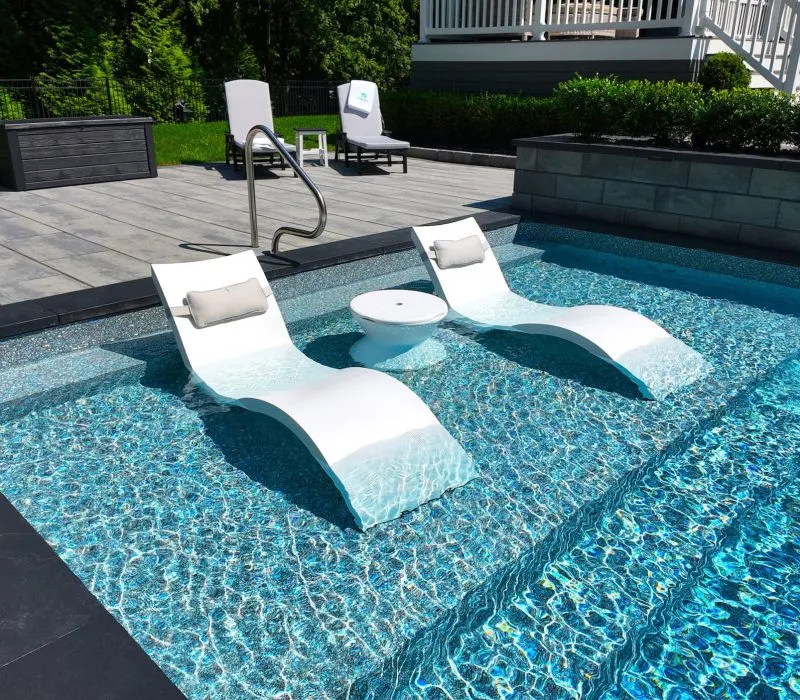 Seats within an inground pool - Puravida Custom Pools