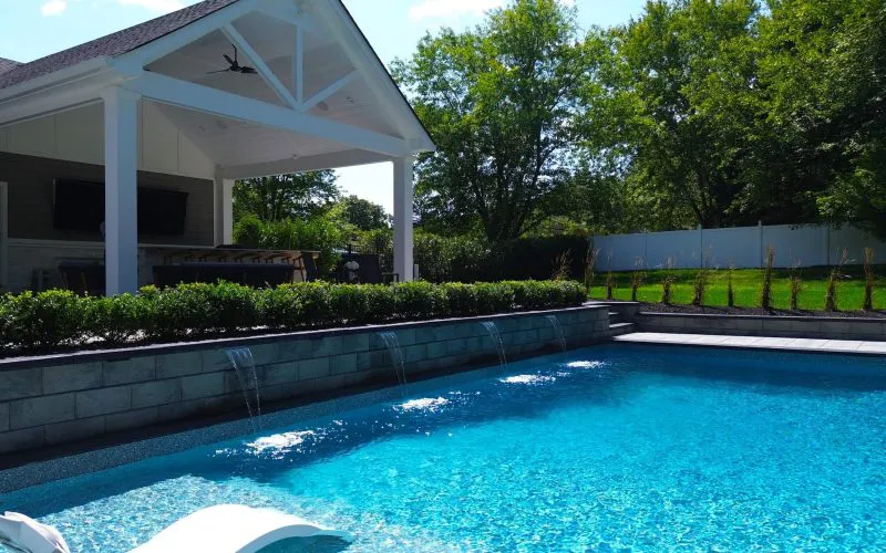 Inground pool with water features - Puravida Custom Pools