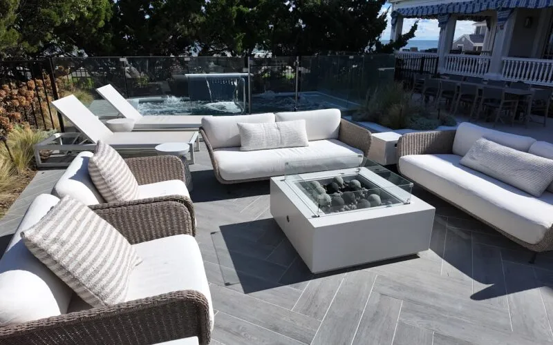 Cocktail pool behind outdoor seating - Puravida Custom Pools