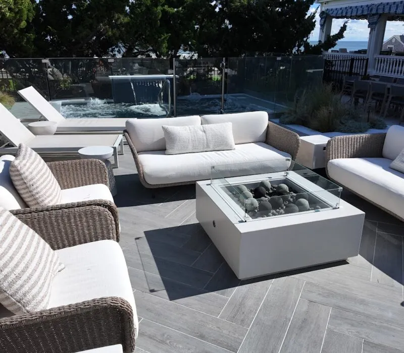 Cocktail pool behind outdoor seating - Puravida Custom Pools